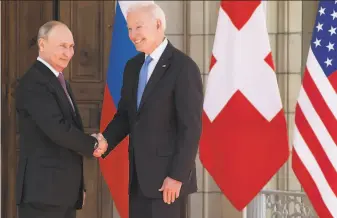  ?? Saul Loeb / Associated Press ?? President Biden and Russian President Vladimir Putin arrive for their meeting Wednesday in Geneva. The two leaders offered starkly different views on such issues as cybersecur­ity.