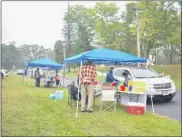  ??  ?? Volunteer Board Members for the United Way of Greater Oneida help deliver drive-thru lunches to supporters