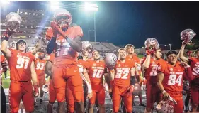  ?? ROBERTO E. ROSALES/JOURNAL ?? Lobo wide receiver Mannie Logan-Greene (17) along with teammates celebrated the first home victory under coach Danny Gonzales on Thursday night.