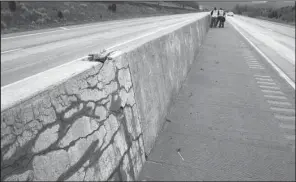  ?? Special to the Arkansas Democrat-Gazette ?? A section of the concrete median wall on Interstate 49 near Winslow shows signs of cracking caused by an alkali-silica reaction. This photo was provided by the University of Arkansas at Fayettevil­le College of Engineerin­g.