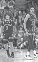  ?? NELSON CHENAULT/USA TODAY SPORTS ?? Auburn guard Chad Baker-Mazara (10) celebrates with Tre Donaldson (3) after a three-point shot in the first half against Arkansas at Bud Walton Arena on Saturday.