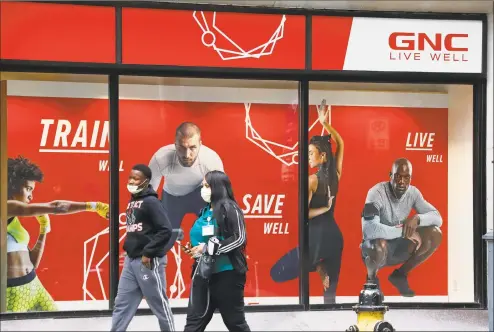  ?? Associated Press ?? GNC included 13 locations in its initial closures after filing in June for bankruptcy protection from creditors, among more than 700 nationally.