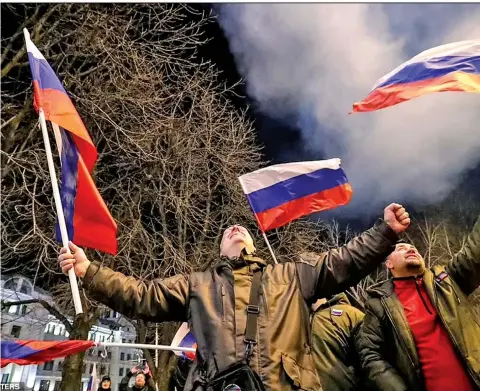  ?? Photo: Reuters ?? Pro-Russian separatist­s in Ukraine celebrated on Monday evening as fireworks went off following Russian President Vladimir Putin signing a decree recognisin­g two Eastern Ukrainian regions as ‘independen­t republics’.