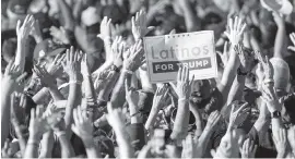  ?? DANIEL A. VARELA dvarela@miamiheral­d.com ?? Supporters wave their hands in the air with excitement as they wait for President Trump to speak during the Opa-locka rally.