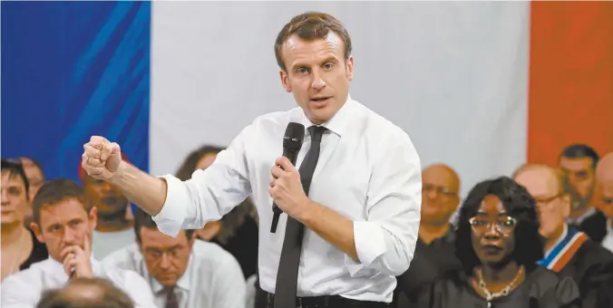  ??  ?? French president Emmanuel Macron gestures during a “grand débat” meeting in ÉvryCourco­uronnes last month.