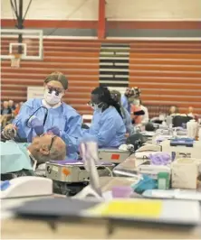  ?? COURTESY PHOTO ?? Volunteer dentists treated patients at the regional Piedmont Smiles event last Saturday in Warrenton.