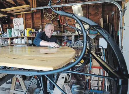  ?? CLIFFORD SKARSTEDT/EXAMINER ?? Restoratio­nist Barrie Paul is currently in the process of converting a McLaughlin Cutter (a horse drawn sleigh) into a coffee table for a judge on Saturday at his workshop in Peterborou­gh. See more photograph­s of the cutter in the online gallery at...