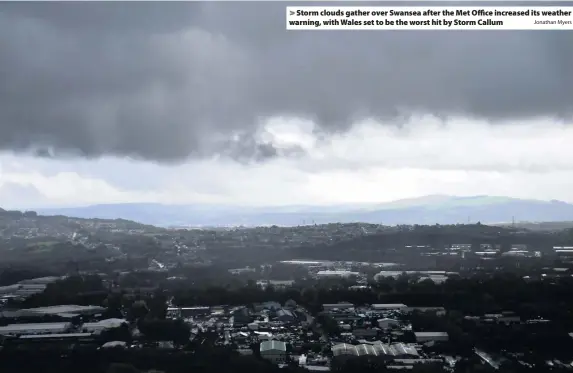  ?? Jonathan Myers ?? &gt; Storm clouds gather over Swansea after the Met Office increased its weather warning, with Wales set to be the worst hit by Storm Callum