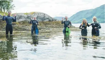  ??  ?? Kate Forbes, second left, gets ready to explore one of the marine sites listed on the new Lochaber Snorkel Trail.