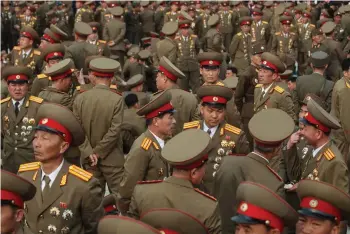  ??  ?? In a photo taken on April 13, 2012, North Korean soldiers attend the unveiling ceremony for two statues of former leaders Kim Il-Sung and Kim Jong-Il in Pyongyang.