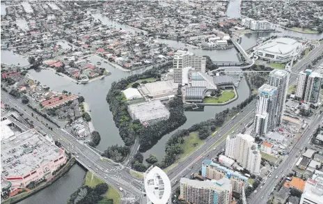  ??  ?? An aerial photo showing the Gold Coast Convention Centre (top right) in Broadbeach soon after its opening in 2004. Bottom left is the Pacific Fair shopping centre. Below left: Konbumerri elder Graham Dillon, Minister State Developmen­t Tom Barton, Jupiters Casino managing director Rob Hines, Yugambeh historian Ysola Best and Premier Peter Beattie sign the convention centre deal in August 2001. Below right: Original 1999 convention centre concept.