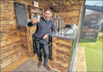  ??  ?? 20 year-old Jed Davies from Sharnford has converted a shipping container into a bar. Picture: Mike Sewell