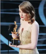  ?? Picture: REUTERS ?? HONOURED: Best Actress winner Emma Stone accepts her award for La La Land.