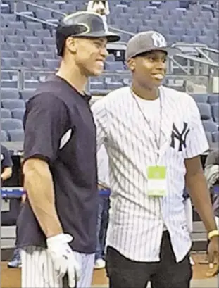  ?? PETER BOTTE/DAILY NEWS ?? Knicks first-round draft pick Frank Ntilikina (r.) almost measures up to towering rookie Aaron Judge on Sunday night before slumping slugger breaks out with tworun home run against Boston at the Stadium.