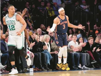  ?? MINCHILLO/AP JOHN ?? Knicks guard Josh Hart reacts after hitting a three-pointer during the first half against the Celtics on Monday in New York.