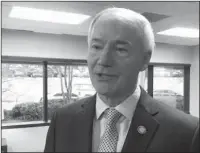  ?? The Associated Press ?? MEDICAID MANDATE: Gov. Asa Hutchinson speaks to reporters Tuesday in Little Rock about his proposed budget for the coming fiscal year. The Republican governor has proposed adding a work requiremen­t to the state’s hybrid Medicaid expansion. GOP leaders...