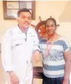  ?? ?? After 19 years, returning seafarer Zaw Myint was happy to meet up again with Jessica Naidoo, one of the helpful staff members at the seafarers centre