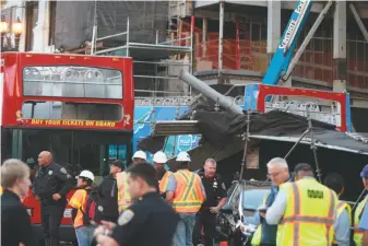  ?? Nathaniel Y. Downes / The Chronicle ?? A tour bus with apparently defective brakes collided with scaffoldin­g on Post Street in Union Square, injuring eight people seriously. The inspection of such vehicles is under scrutiny.