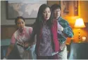  ?? Courtesy of Elevation Pictures ?? From left, Stephanie Hsu, Michelle Yeoh and Ke Huy Quan star as the Wang family in “Everything
Everywhere All At Once.”