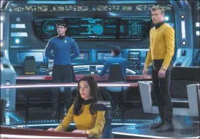  ?? Michael Gibson / Associated Press ?? This image released by CBS All Access shows, from left, Ethan Peck as Spock, Rebecca Romijn as Number One and Anson Mount as Captain Pike of the the CBS All Access series “Star Trek: Strange New Worlds.”