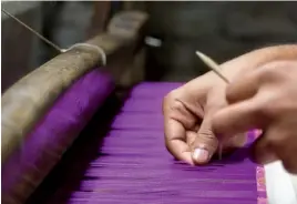  ??  ?? From top: The weaving industry of Varanasi is a mishmash of various cultural aesthetics; a man weaves silk on a foot-powered loom.