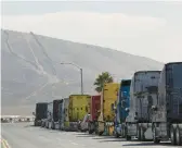  ?? ANA RAMIREZ/THE SAN DIEGO UNION-TRIBUNE 2021 ?? Semitraile­r trucks are lined up near the Otay Mesa Port of Entry in California. Changes are coming to the trucking industry.