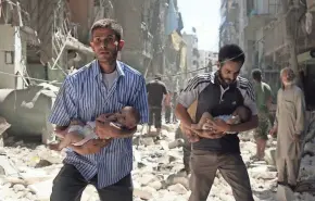  ?? GETTY IMAGES ?? Syrian men carrying babies make their way through the rubble of destroyed buildings after a reported airstrike Sunday on the rebel-held Salihin neighborho­od in Aleppo.