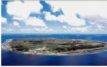  ?? photo. — AFP ?? Limited access: An aerial photo of the island state of the Republic of Nauru in this 2001 file