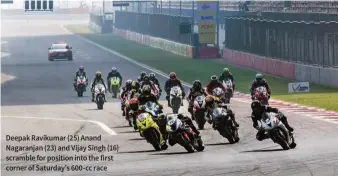  ??  ?? Deepak Ravikumar (25) Anand Nagaranjan (23) and Vijay Singh (16) scramble for position into the first corner of Saturday’s 600-cc race