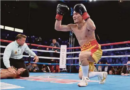  ?? AFP PIC ?? Srisaket Sor Rungvisai celebrates as Roman Gonzalez is counted out in their WBC super flyweight world title fight on Saturday.