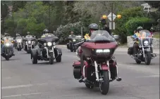  ?? ?? The convoy of motorcycli­sts leave the downtown area during the Swift Current Ride for Dad parade, June 11.