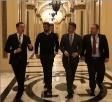  ?? Courtesy of Chris Edwards ?? The Milk Shake Factory CEO and co-owner Chris Edwards, second from right, was part of George H.W. Bush's state funeral staff along with John Plack, far left, and Russell Bermel, far right. They are pictured with his partner, Albert Fonticiell­a, leaving the U.S. Capitol Rotunda on Tuesday after paying their respects to the late president.