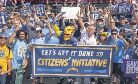  ?? KIRBY LEE, USA TODAY SPORTS ?? Dan Jauregui, aka Boltman, and other Chargers fans back a downtown stadium. A proposal to tax visitors for it faces a vote.