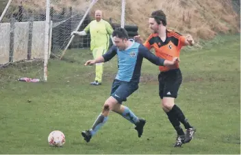  ??  ?? A Whitby Fishermen defender shields the ball from Edgehill’s Dean Craig