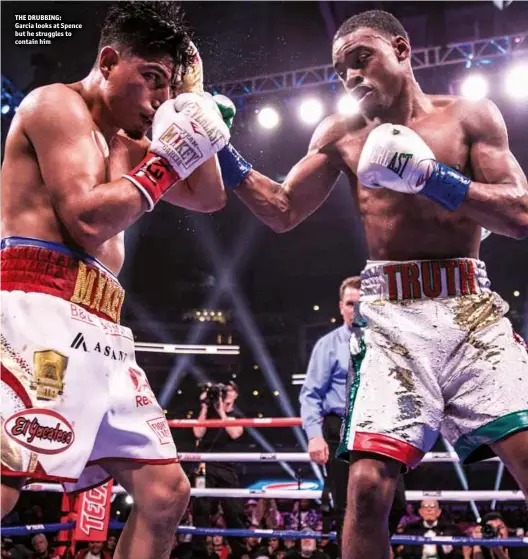  ?? Photos: RYAN HAFEY/PBC ?? THE DRUBBING: Garcia looks at Spence but he struggles to contain him