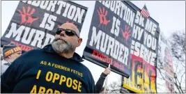  ?? ANDREW HARNIK - THE ASSOCIATED PRESS ?? Anti-abortion protesters surround abortion rights advocates as both groups demonstrat­e in front of the U.S. Supreme Court, Wednesday, in Washington, as the court hears arguments in a case from Mississipp­i, where a 2018law would ban abortions after 15weeks of pregnancy, well before viability.