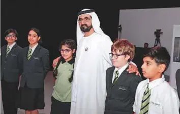  ?? WAM ?? Shaikh Mohammad Bin Rashid with students on the sidelines of the opening ceremony of the Knowledge Summit 2017 in Dubai yesterday.