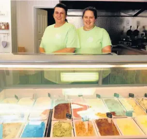  ??  ?? Kate Buche and Emma Hamawand behind the counter at Adi’s, a dessert cafe in Bridgend