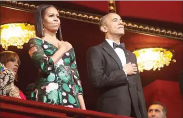  ?? CHRIS KLEPONIS/AFP ?? US President Barack Obama and first lady Michelle Obama stand for the National Anthem during the 2016 Kennedy Center Honors on Sunday, in Washington, DC.