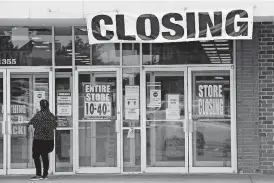  ?? [JEFF ROBERSON/ THE ASSOCIATED PRESS] ?? A woman walks into a closing Gordmans store, Thursday, in St. Charles, Mo. Stage Stores, which owns Gordmans, is closing all its stores and has filed for Chapter 11 bankruptcy.