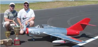  ??  ?? Above: 2014 Mr. Top Gun David Ribbe (right) with his MiG-15bis.