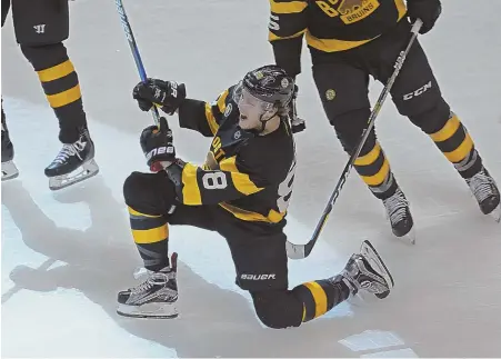  ?? STAFF FILE PHOTO BY JOHN WILCOX ?? ANOTHER ONE BITES THE DUST? David Pastrnak scored 34 goals last season, including this third-period gamewinner against Vancouver back in February, but will he be the next young Bruins sniper to leave Boston?