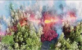  ?? REUTERS PIC ?? Lava emerging from the ground after Kilauea volcano erupted, on Hawaii’s Big Island on Friday.