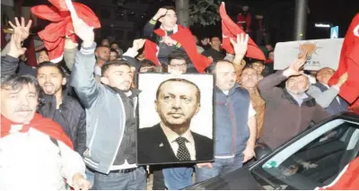  ??  ?? FOLLOW THE LEADER: Supporters of Turkish President Recep Tayyip Erdogan demonstrat­e at the Turkish Consulate in Stuttgart, Germany, last week. (AP)