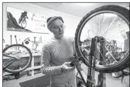  ?? NWA Democrat-Gazette/BEN GOFF • @NWABENGOFF ?? Steve Marquess, a volunteer from Bentonvill­e, trues a bicycle wheel Dec. 26 at Pedal it Forward NWA in Bentonvill­e.