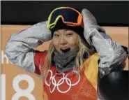  ?? GREGORY BULL — THE ASSOCIATED PRESS ?? Chloe Kim of the United States reacts to her score during the women’s halfpipe finals at Phoenix Snow Park at the Winter Olympics in Pyeongchan­g, South Korea, on Feb. 13.