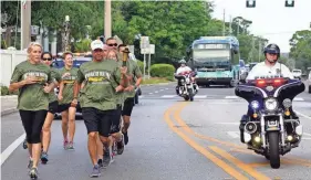  ?? PROVIDED BY SARASOTA POLICE DEPARTMENT ?? Members of the Sarasota Police Department have taken part in the Law Enforcemen­t Torch Run for Special Olympics for more than 20 years. The annual event returns to the streets of Sarasota on Friday.