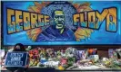  ??  ?? Flowers, signs and balloons are left at a makeshift memorial to George Floyd near the spot where he was murdered by policeman Derek Chauvin. Photograph: Kerem Yucel/AFP/Getty Images