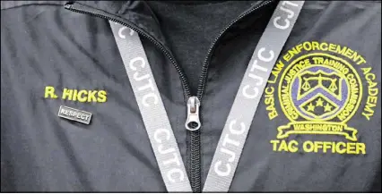  ?? ELAINE THOMPSON / ASSOCIATED PRESS ?? Officer Russ Hicks wears a “Respect” button to emphasize how police should interact with others, at the Washington State Criminal Justice Training Commission in Burien, Wash.