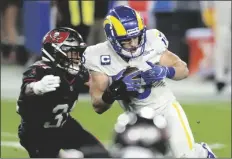  ?? ASSOCIATED PRESS ?? LOS ANGELES RAMS WIDE RECEIVER COOPER KUPP (10) eludes a tackle by Tampa Bay Buccaneers strong safety Antoine Winfield Jr. (31) during an NFL game Monday in Tampa, Fla.